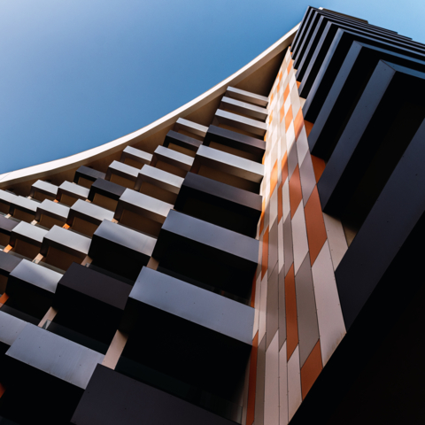 Modern building with square balconies seen from below. Modern architecture.