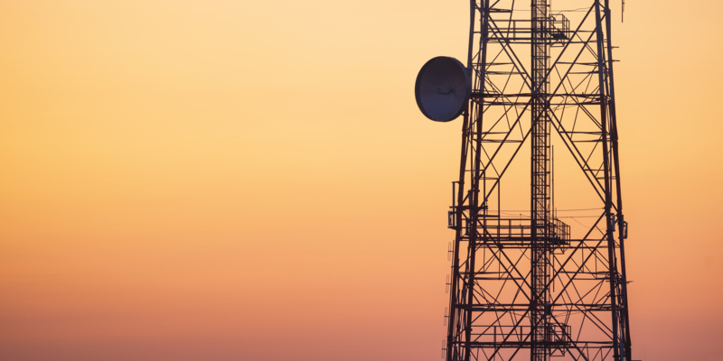 Silhouette of communication tower for broadcasting during sunrise time.