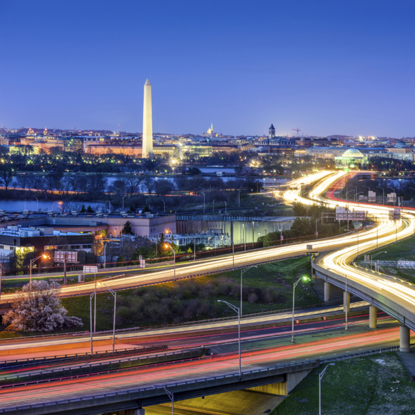 Washington D.C., skyline with highways and monuments.