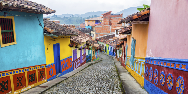 Colorful colonial houses on a cobblestone street in Guatape, Antioquia in Colombia