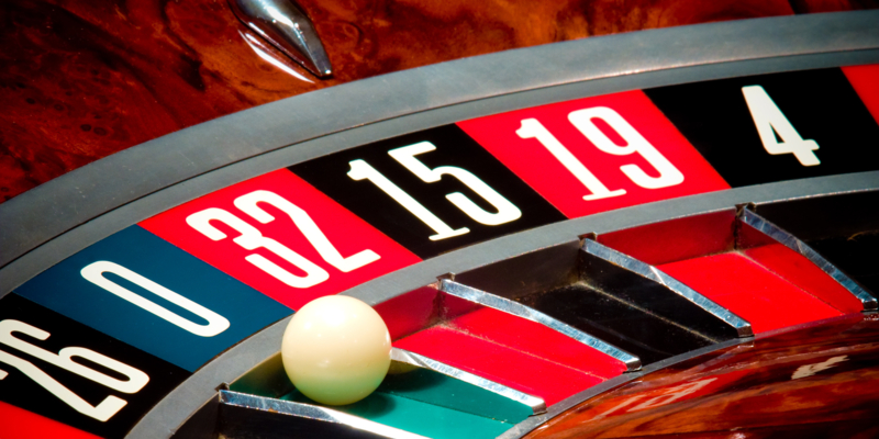 Close up of roulette wheel and ball in casino.  