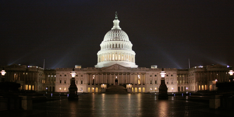 The dome of the United States Capitol lit at night in Washington, DC.