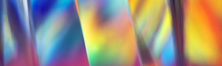 Striped glass surface with holographic color effects, close-up