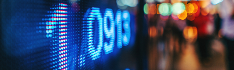 display stock market numbers with defocused street lights background 