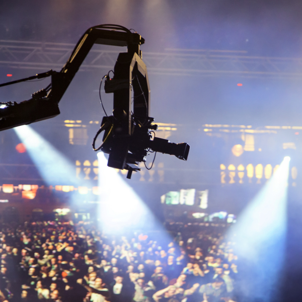 Television HDV camera on a crane broadcasting from a music concert.