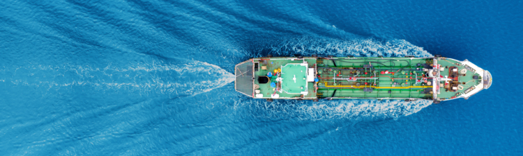Aerial view shot tanker ship moving on the sea.
